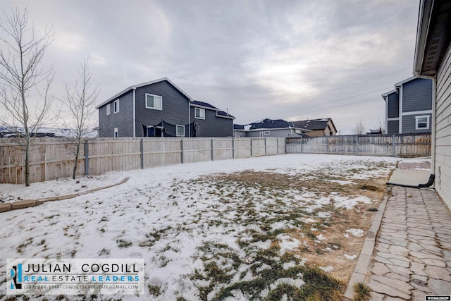 view of yard covered in snow