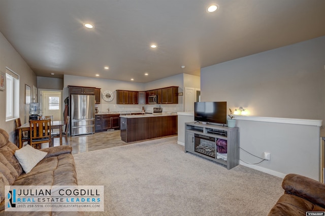 carpeted living room with sink