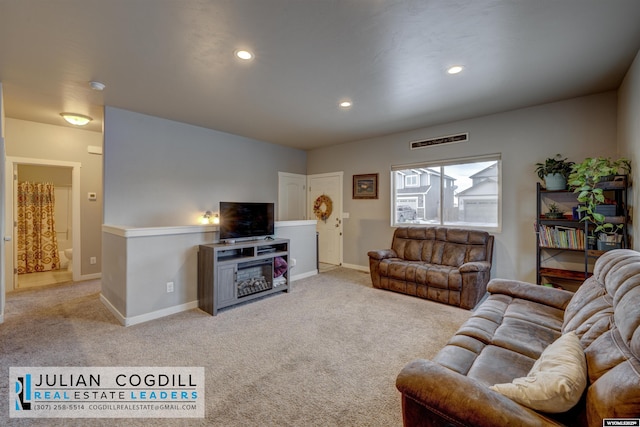 living room featuring light carpet