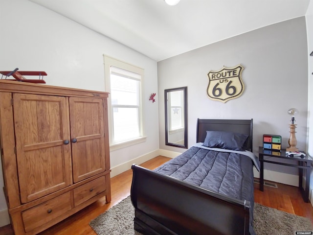 bedroom with light hardwood / wood-style floors