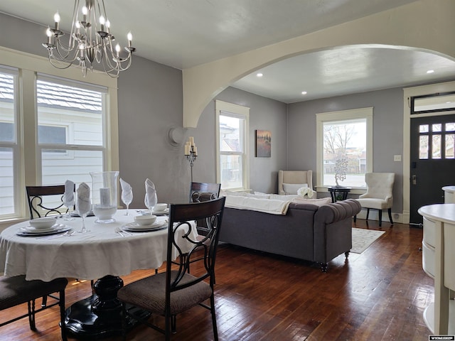 dining room featuring a chandelier and dark hardwood / wood-style floors