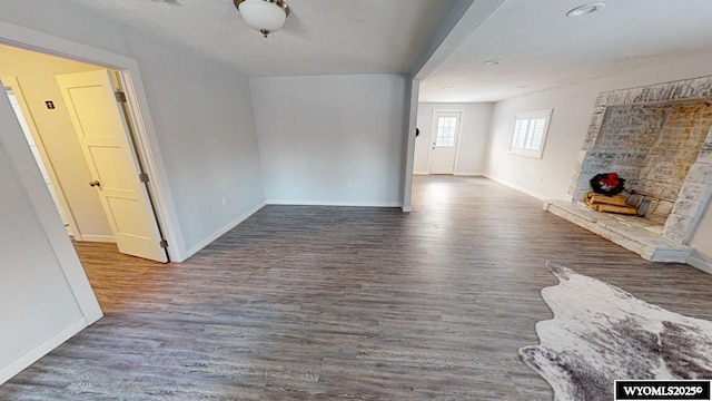 interior space featuring dark hardwood / wood-style floors and a fireplace