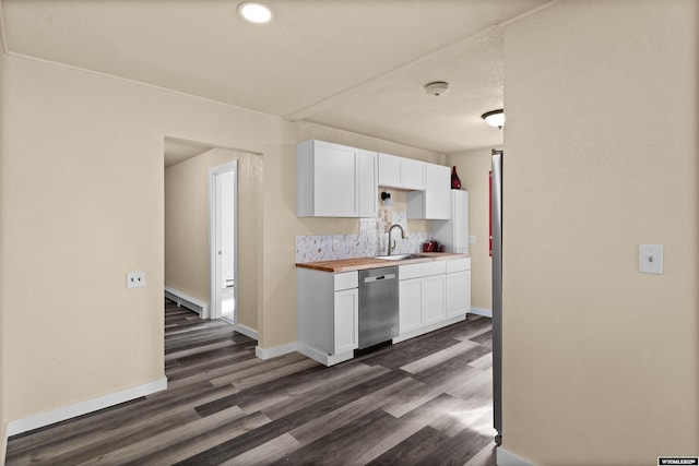 kitchen with backsplash, dishwasher, white cabinets, and wooden counters