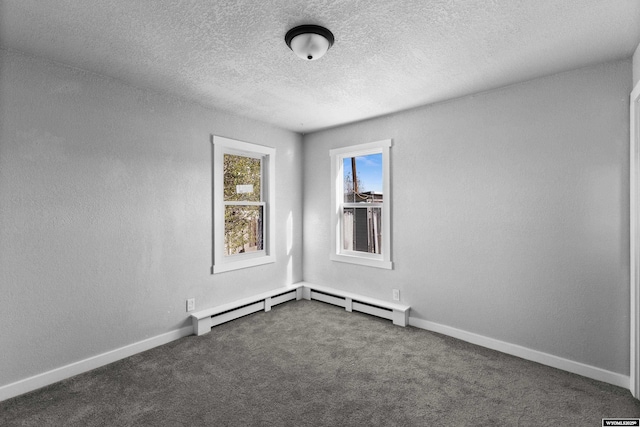 spare room with dark colored carpet