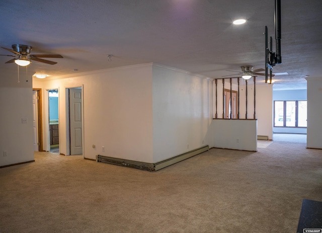 spare room with light carpet, ceiling fan, ornamental molding, and a baseboard radiator