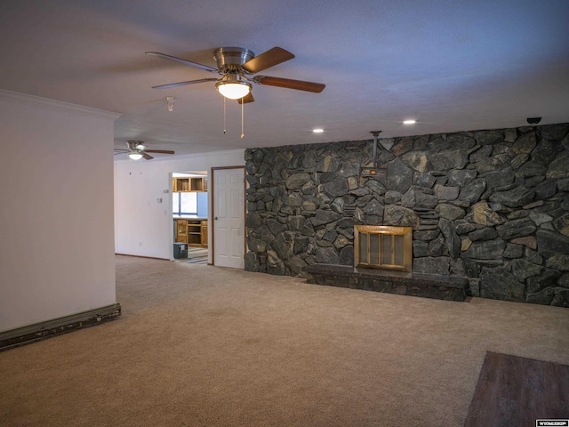 unfurnished living room with crown molding, a fireplace, and carpet floors