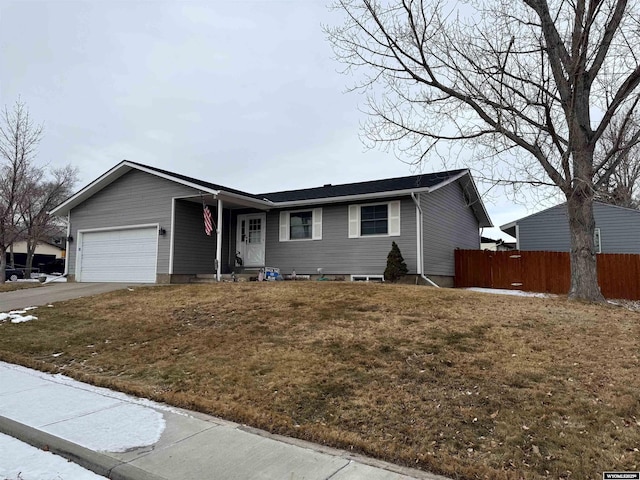 ranch-style house with a garage and a front yard