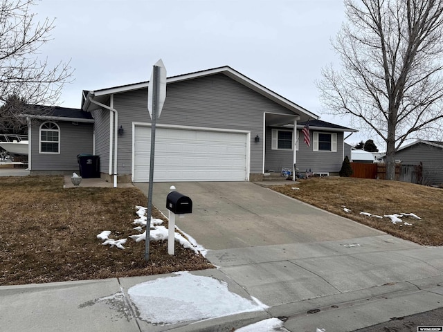 ranch-style home featuring a garage