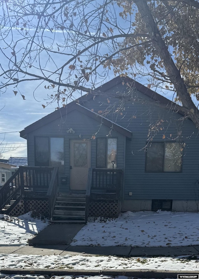 view of snow covered house