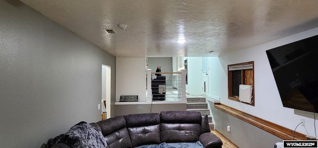 living room with a textured ceiling