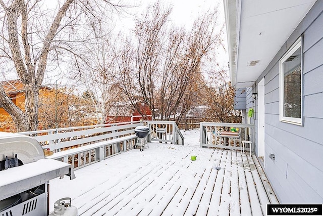 view of snow covered deck