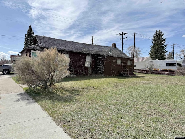 1101 Pine Ave, Kemmerer, WY 83101 - view of property exterior with a lawn