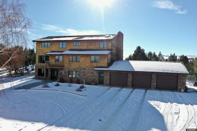 151 Cedar Ridge Dr, Thermopolis, WY 82443 - view of front of property with a balcony, a chimney, and stone siding