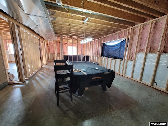 dining space featuring concrete floors