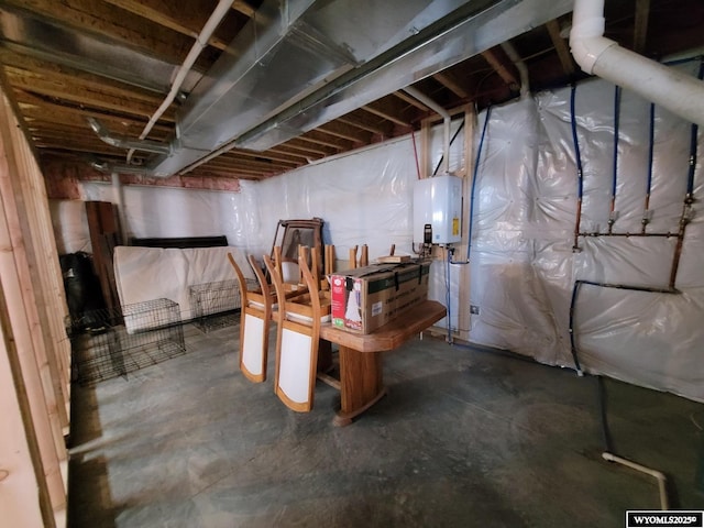 basement featuring tankless water heater