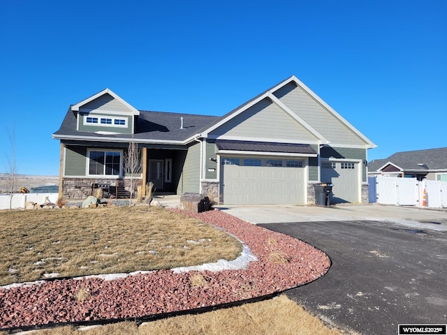 craftsman-style home with a garage and covered porch