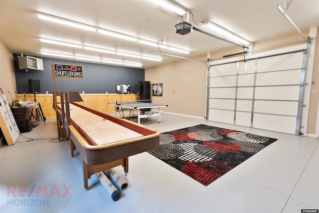 playroom featuring concrete flooring and an AC wall unit