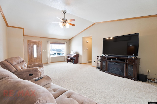 carpeted living room with vaulted ceiling, ceiling fan, and crown molding