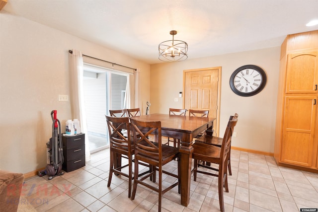 tiled dining space featuring a notable chandelier