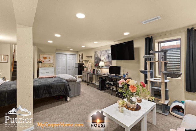 carpeted bedroom with a closet