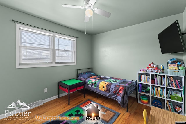 bedroom with hardwood / wood-style flooring and ceiling fan