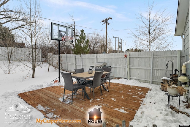 view of snow covered deck