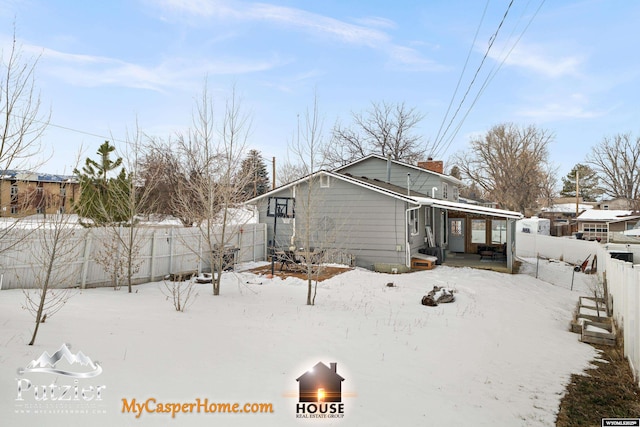 view of snow covered house