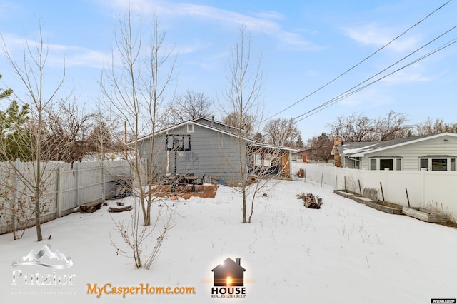 view of yard covered in snow