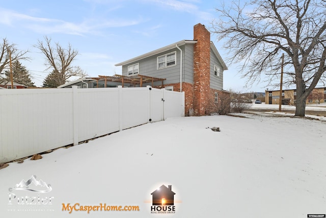 view of yard layered in snow