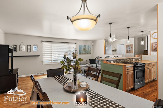 dining area with hardwood / wood-style floors