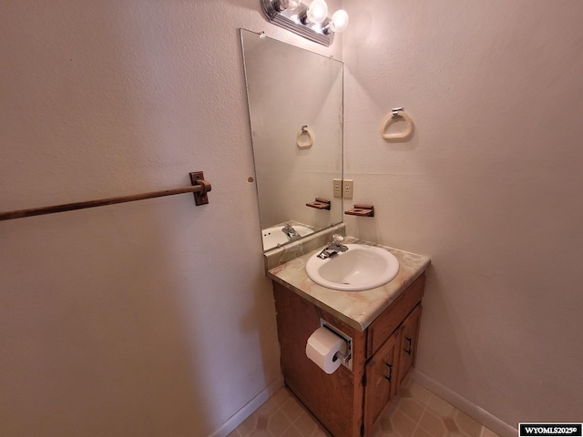 bathroom with vanity and tile patterned flooring