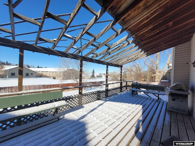 snow covered deck featuring a grill