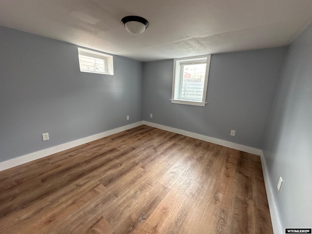 unfurnished room featuring hardwood / wood-style floors