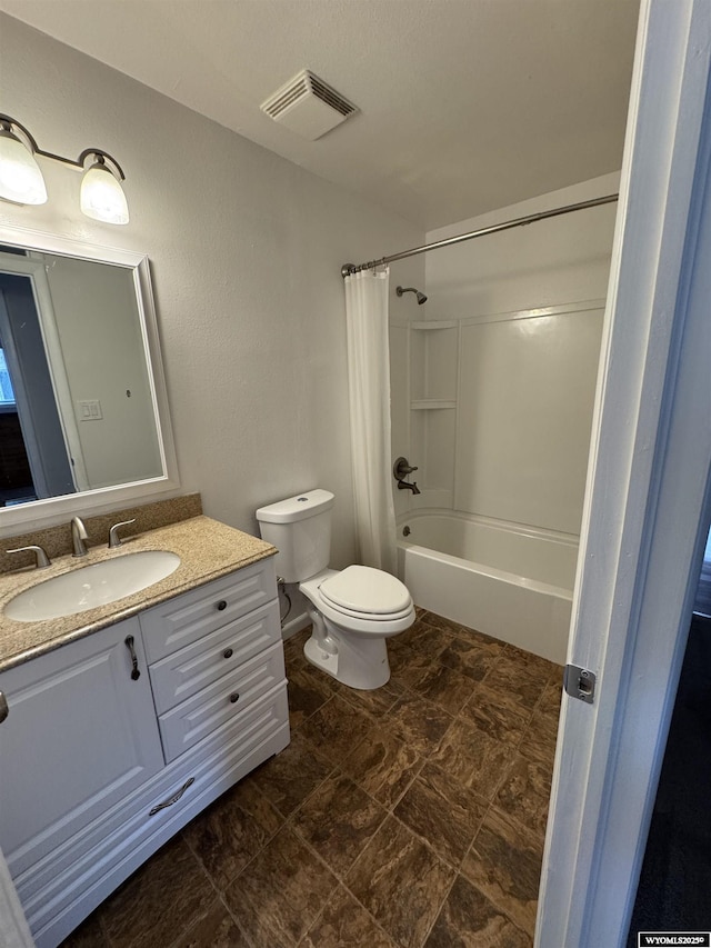 full bathroom with toilet, vanity, and shower / bath combo