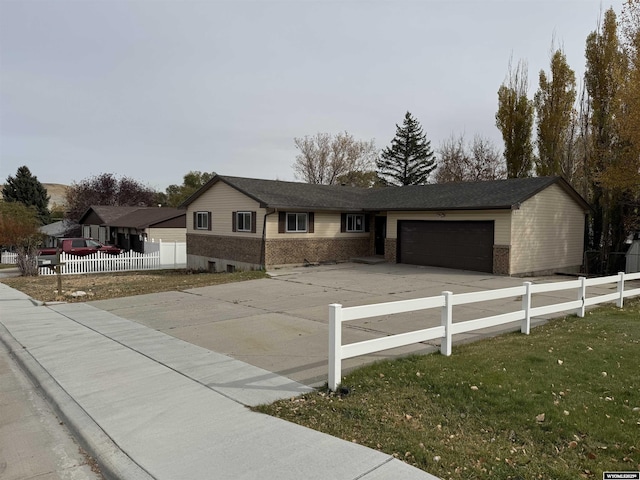 view of front facade with a front lawn and a garage