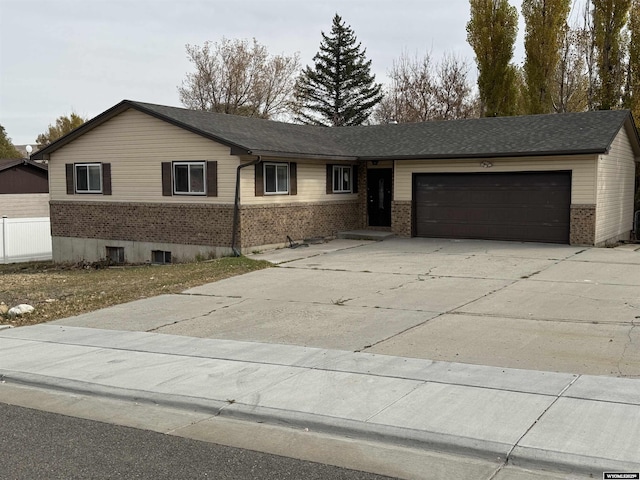 single story home with a garage