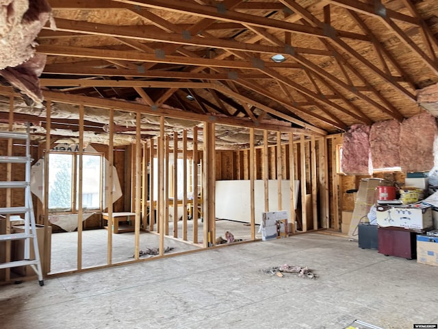 miscellaneous room with lofted ceiling