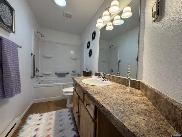 full bathroom with toilet, vanity, hardwood / wood-style floors, shower / bathing tub combination, and a baseboard radiator