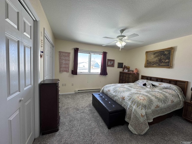 bedroom featuring ceiling fan, a textured ceiling, a baseboard heating unit, and carpet floors