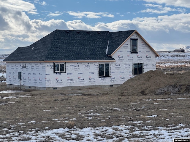 view of snow covered property