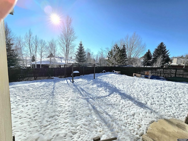 view of yard covered in snow