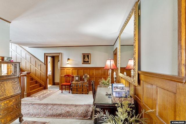 living room with wood walls and carpet flooring