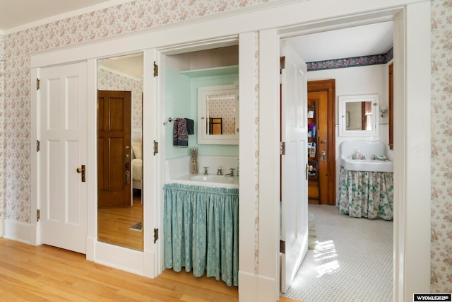 hallway with hardwood / wood-style floors