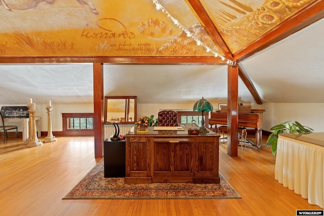 home office with hardwood / wood-style flooring and lofted ceiling