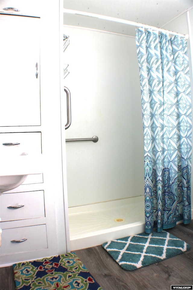 925 Jefferson Ave, Rock Springs, WY 82901 - bathroom with hardwood / wood-style flooring and walk in shower