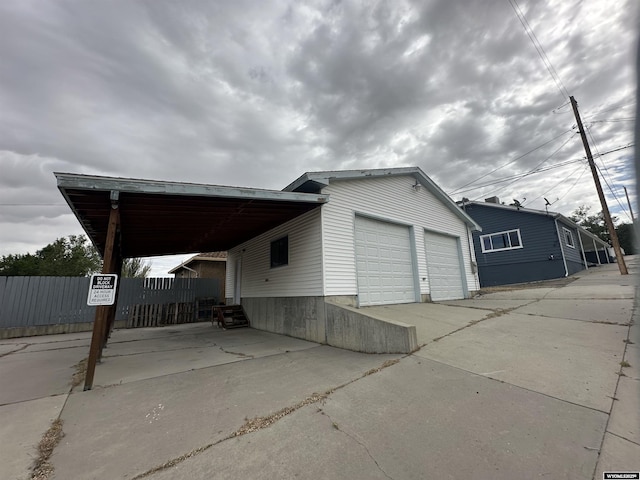 view of side of home with a garage