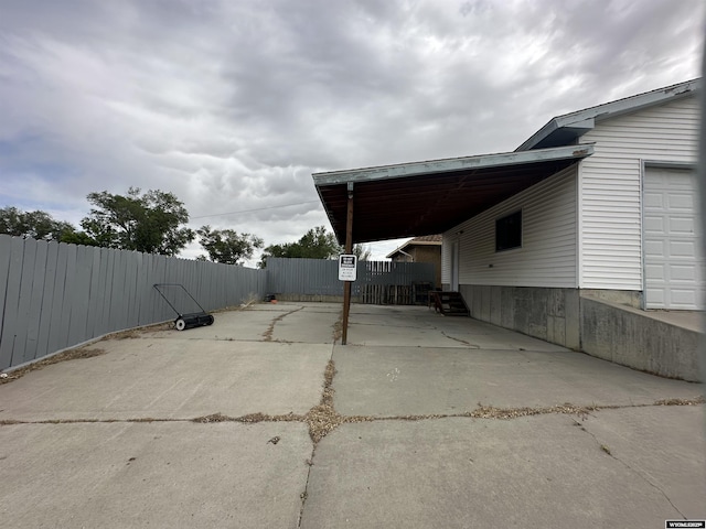 exterior space with a carport