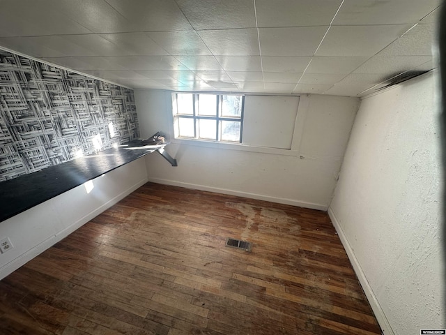 spare room featuring dark wood-type flooring