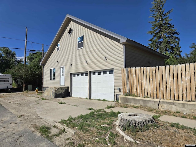 view of side of property with a garage