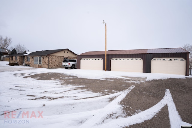 ranch-style house featuring a garage